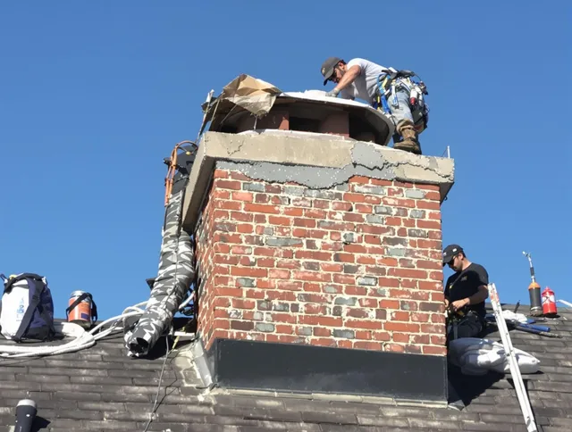 Rock Hill Chimney Sweep installing a custom chimney crown in Rock Hill, SC