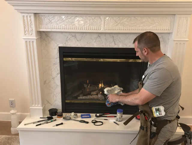Rock Hill Chimney Sweep performing fireplace maintenance in Rock Hill, SC